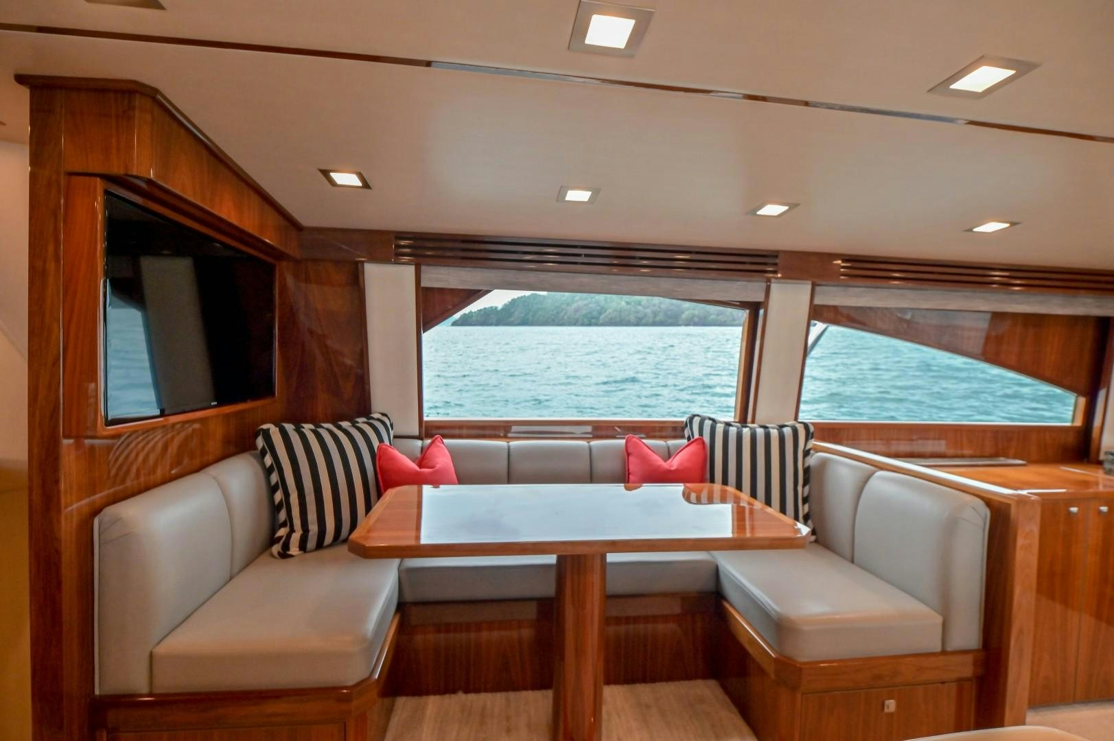 a room with a table and chairs aboard GOOSE Yacht for Sale