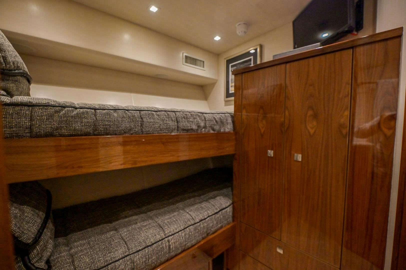 a room with wooden furniture aboard GOOSE Yacht for Sale