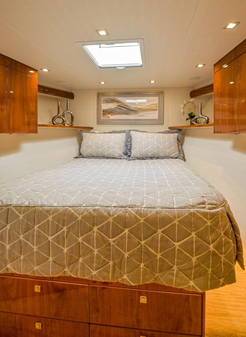 a bed with white sheets aboard GOOSE Yacht for Sale