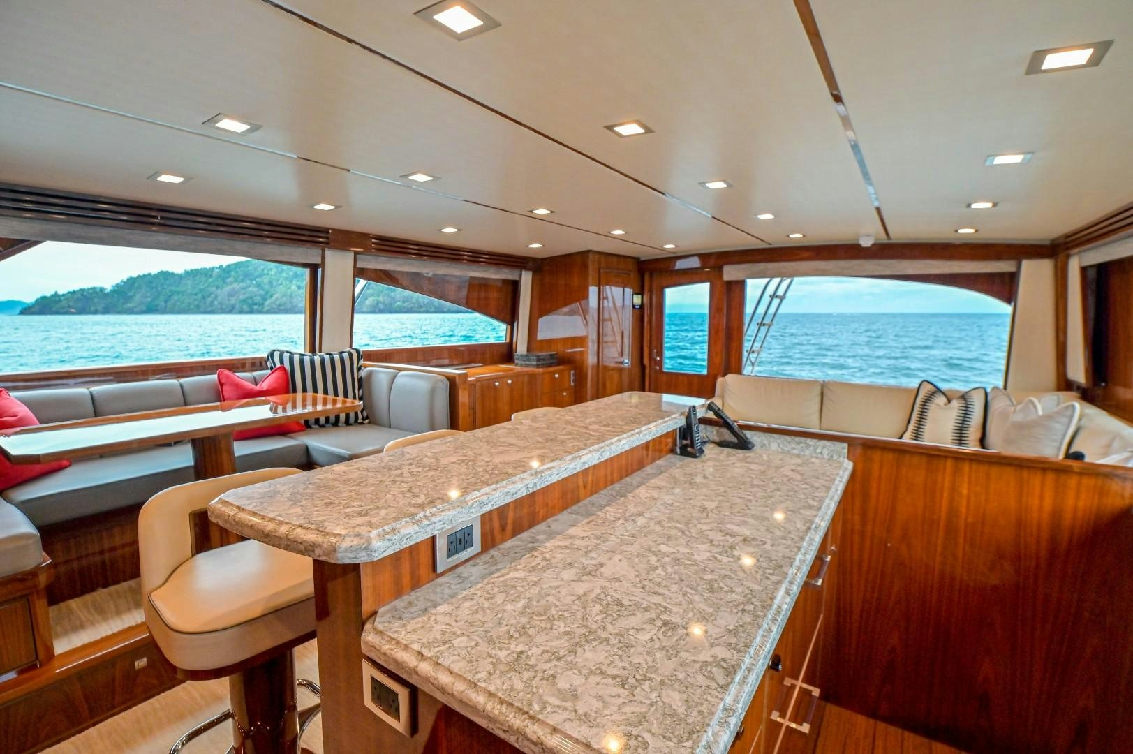 a large room with a table and chairs aboard GOOSE Yacht for Sale