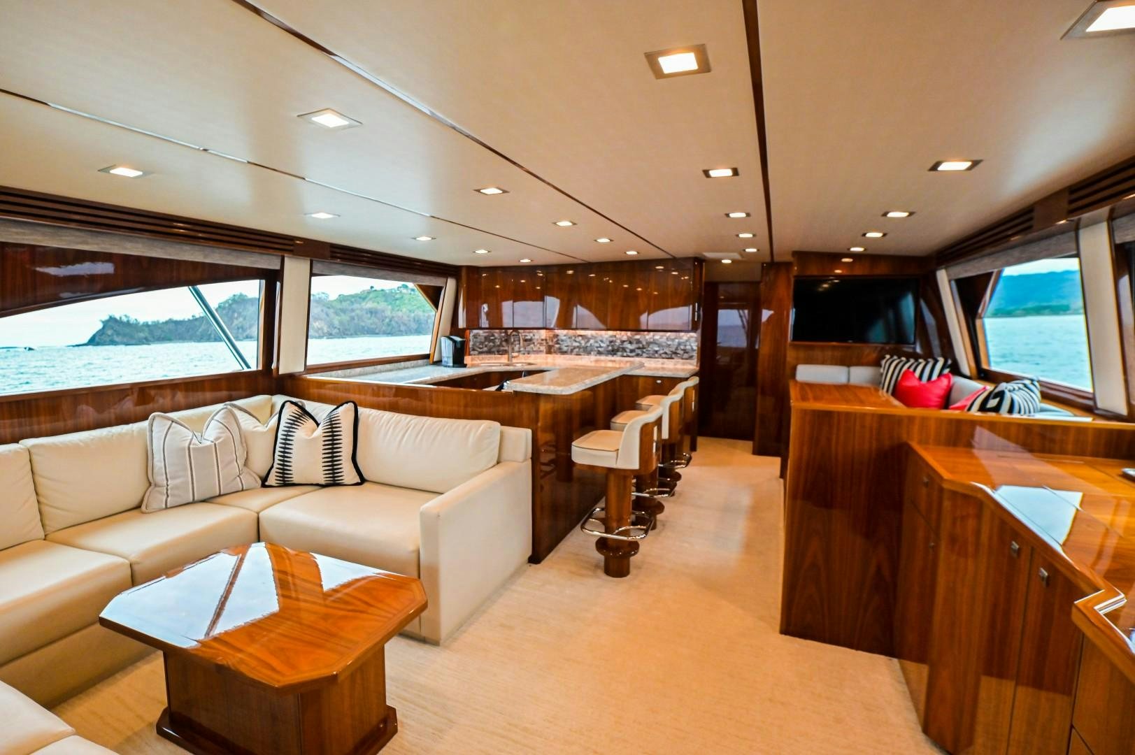 a living room with a couch and a table aboard GOOSE Yacht for Sale