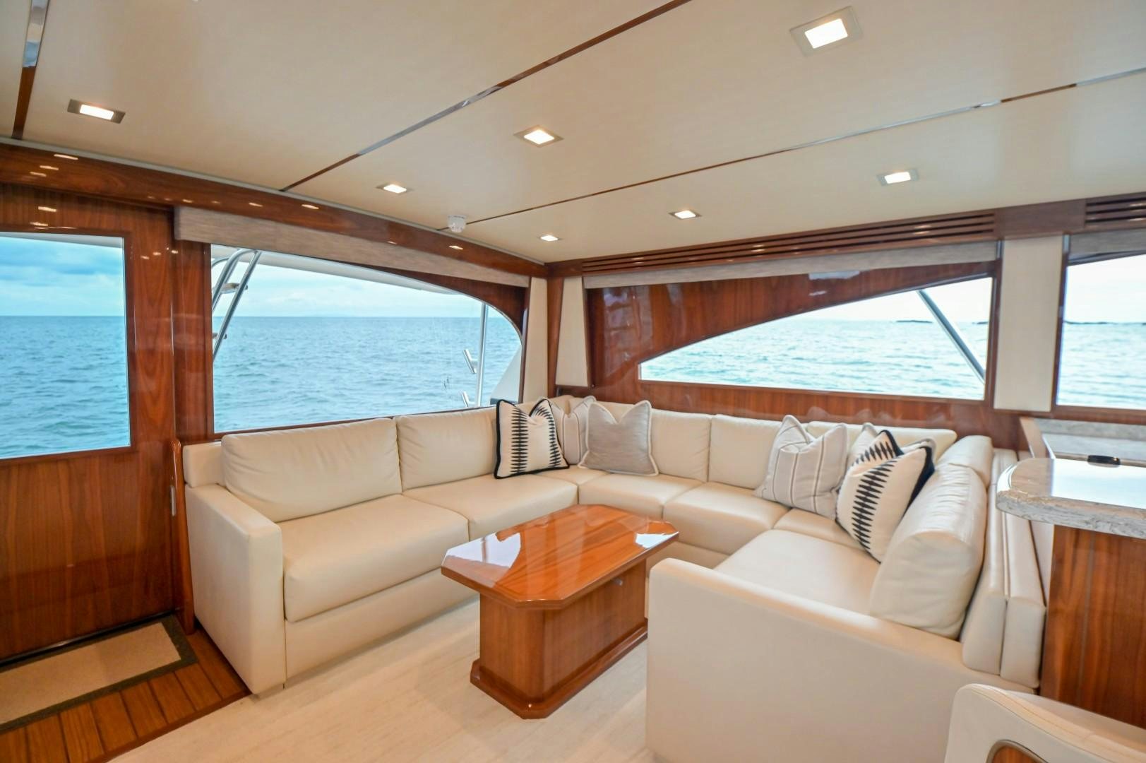 a living room with a couch and a table aboard GOOSE Yacht for Sale