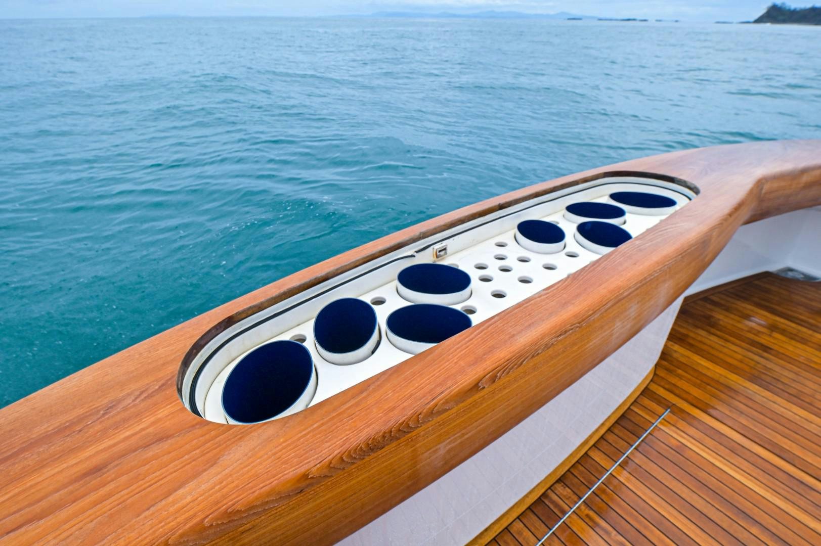 a white rectangular device on a wooden surface aboard GOOSE Yacht for Sale