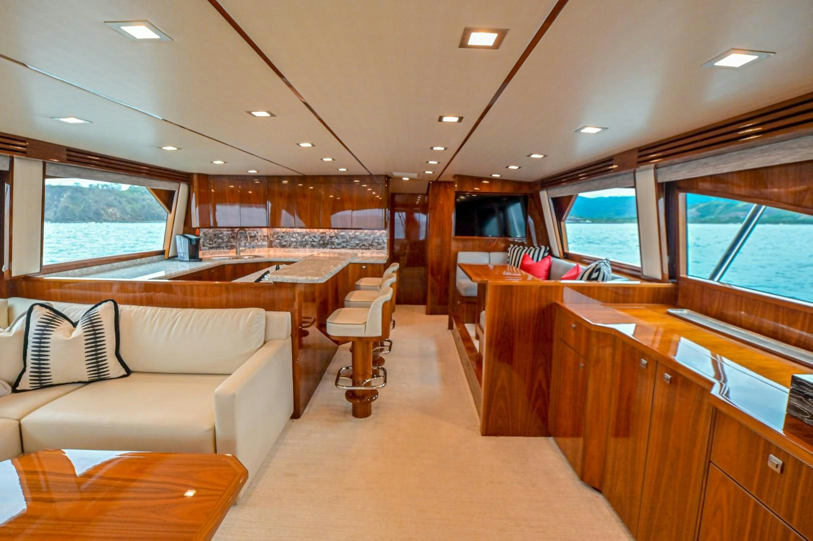 a living room with a couch and a table aboard GOOSE Yacht for Sale