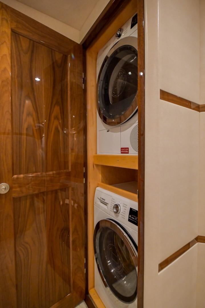 a closet with a washing machine aboard GOOSE Yacht for Sale