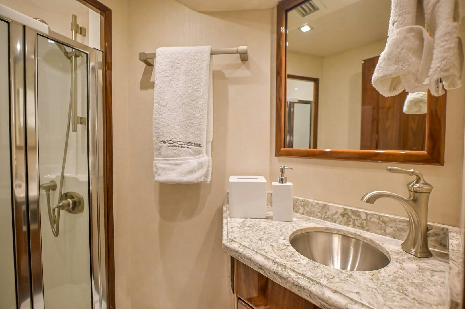 a bathroom with a sink and a shower aboard GOOSE Yacht for Sale