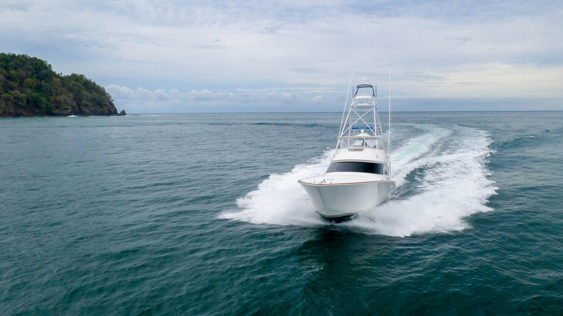 a white boat on the water aboard GOOSE Yacht for Sale
