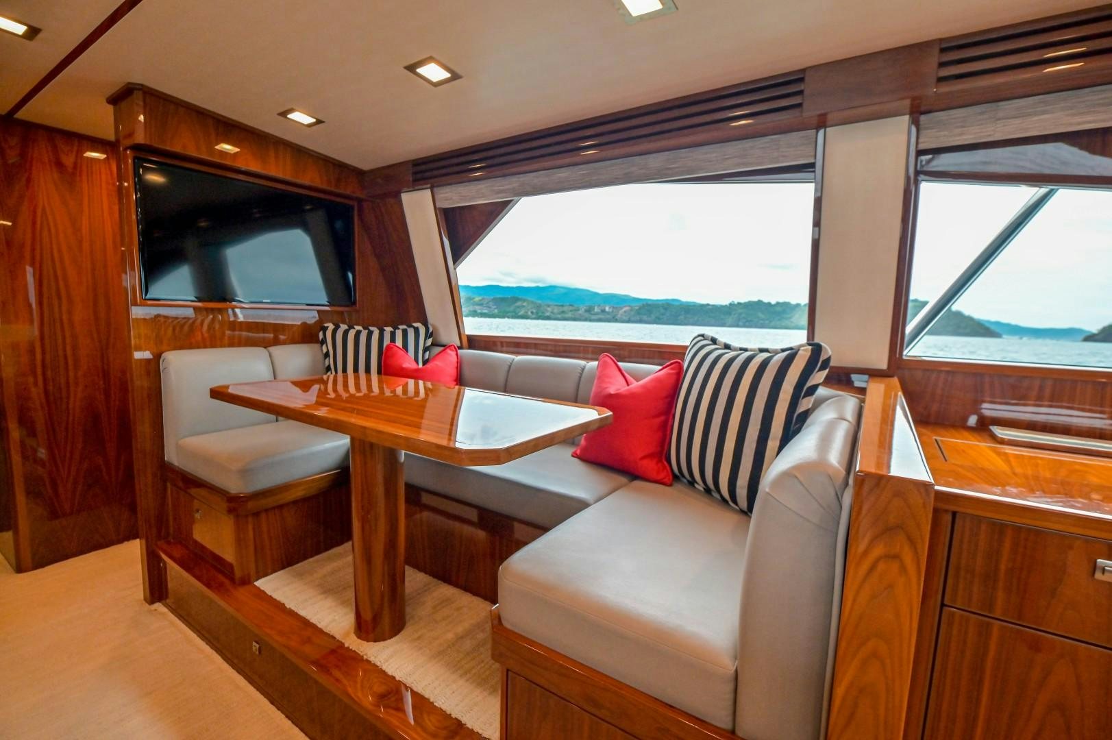 a living room with a couch and a table aboard GOOSE Yacht for Sale