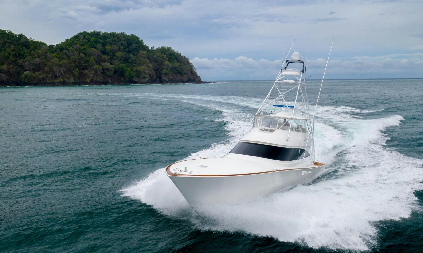 a white boat on the water aboard GOOSE Yacht for Sale