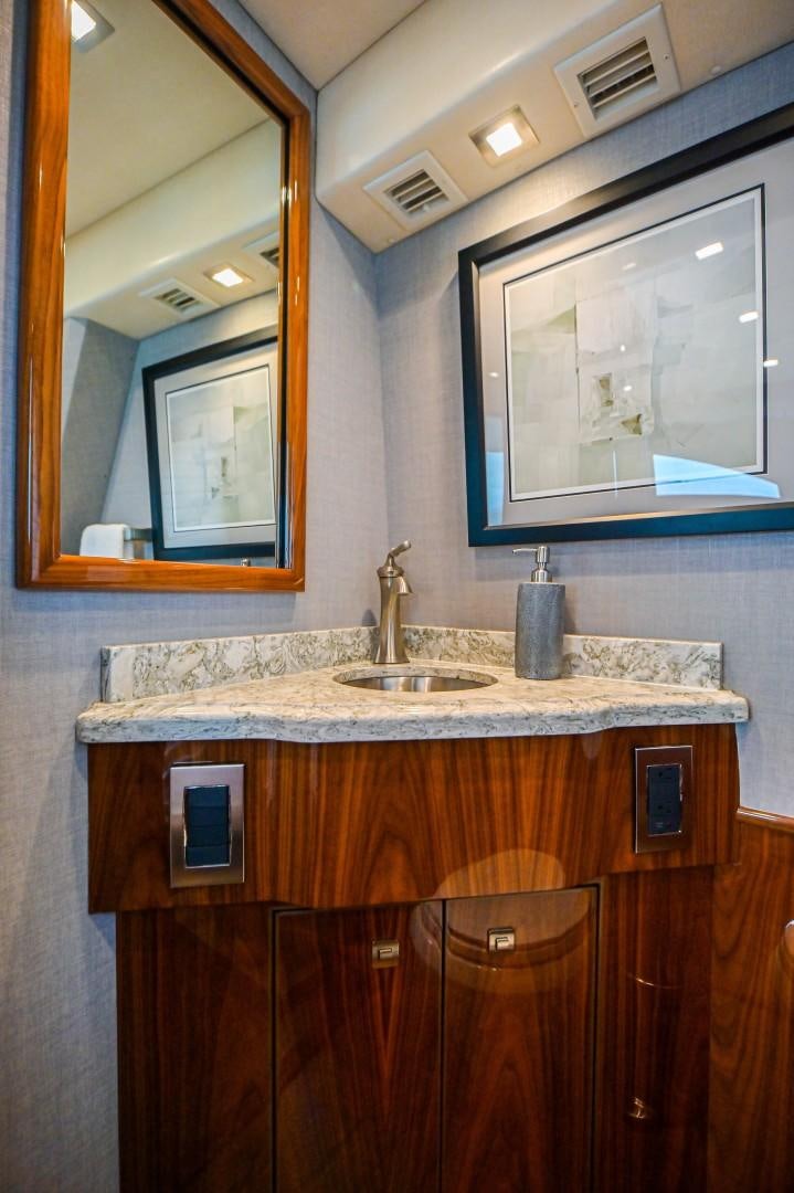 a bathroom with a sink and a mirror aboard GOOSE Yacht for Sale