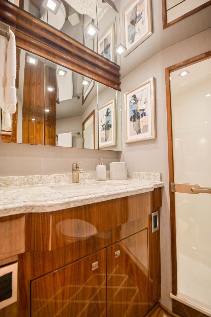 a bathroom with a marble counter top aboard GOOSE Yacht for Sale