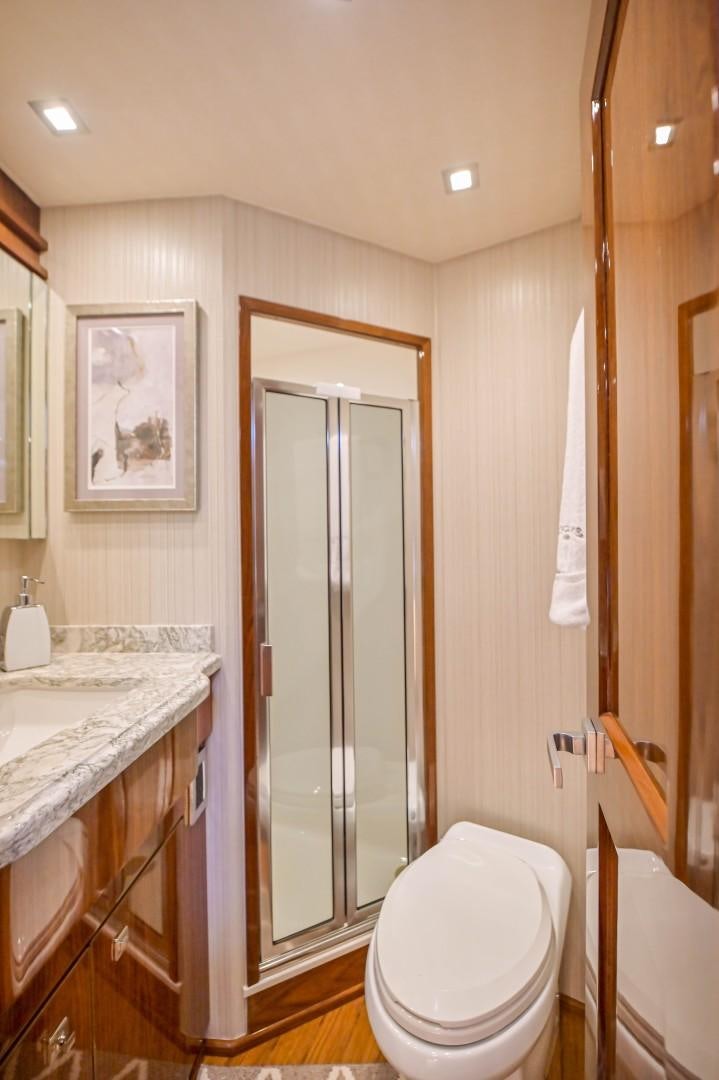 a bathroom with a toilet and a sink aboard GOOSE Yacht for Sale