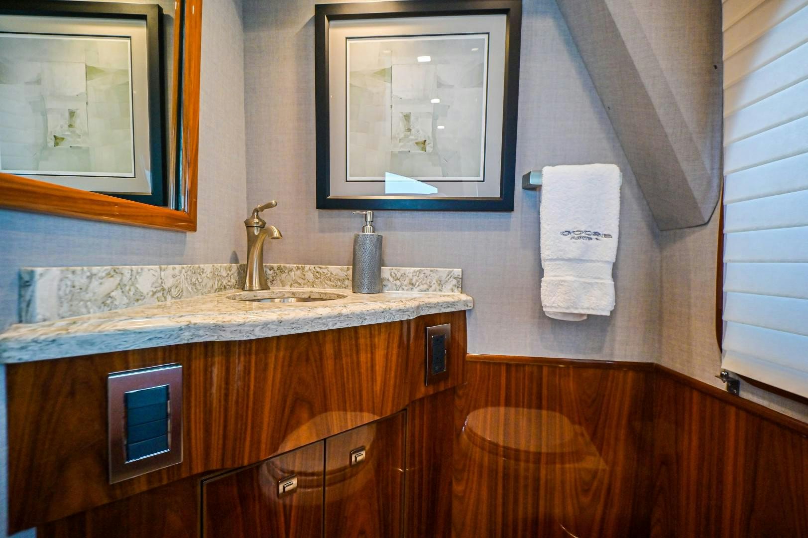 a bathroom with a sink and a mirror aboard GOOSE Yacht for Sale