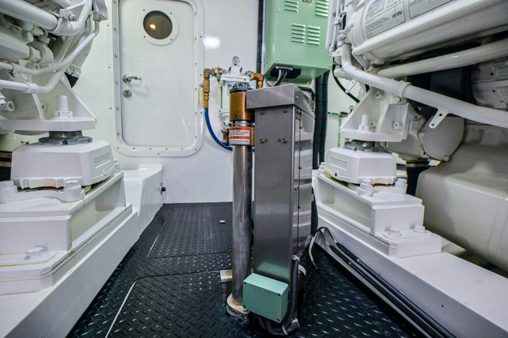 a machine with a large piece of equipment in it aboard GOOSE Yacht for Sale