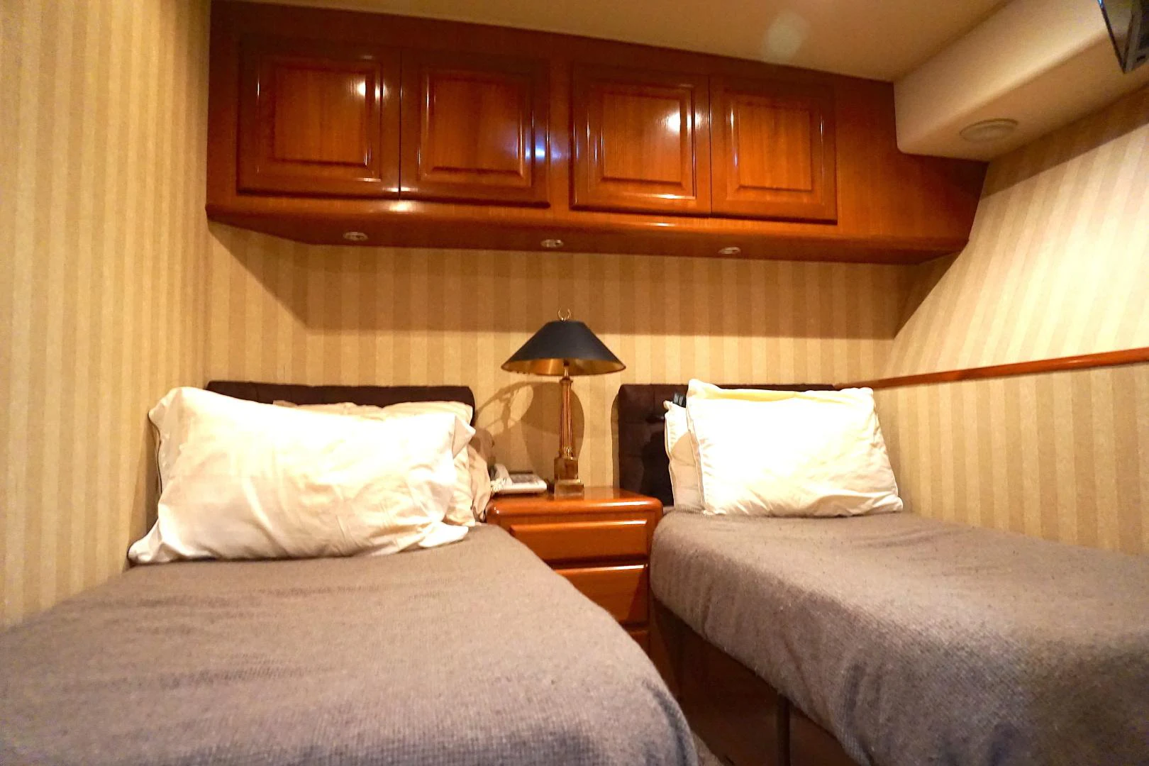 a couple of beds in a hotel room aboard CROWN ROYAL Yacht for Sale