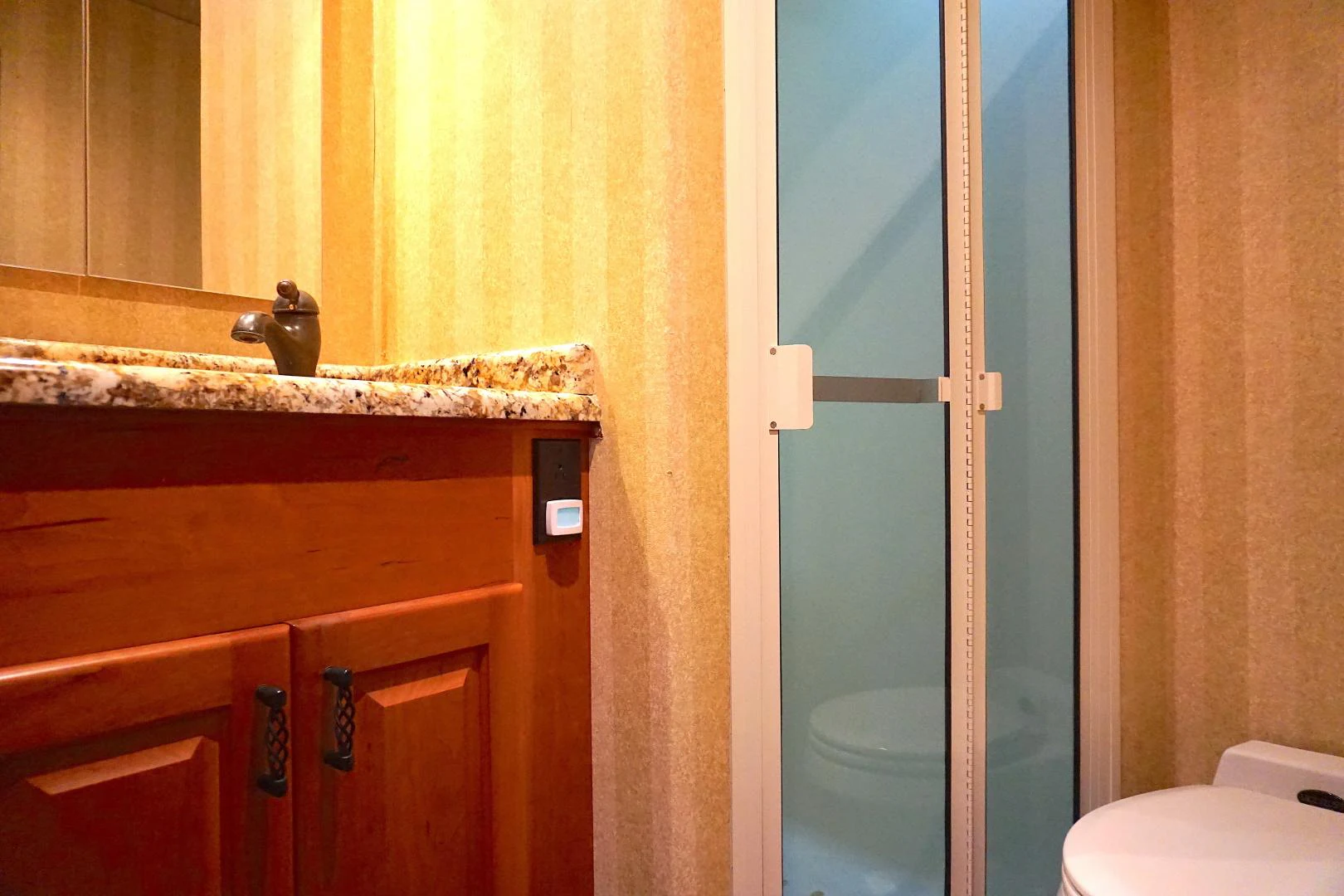 a bathroom with a sink and toilet aboard CROWN ROYAL Yacht for Sale