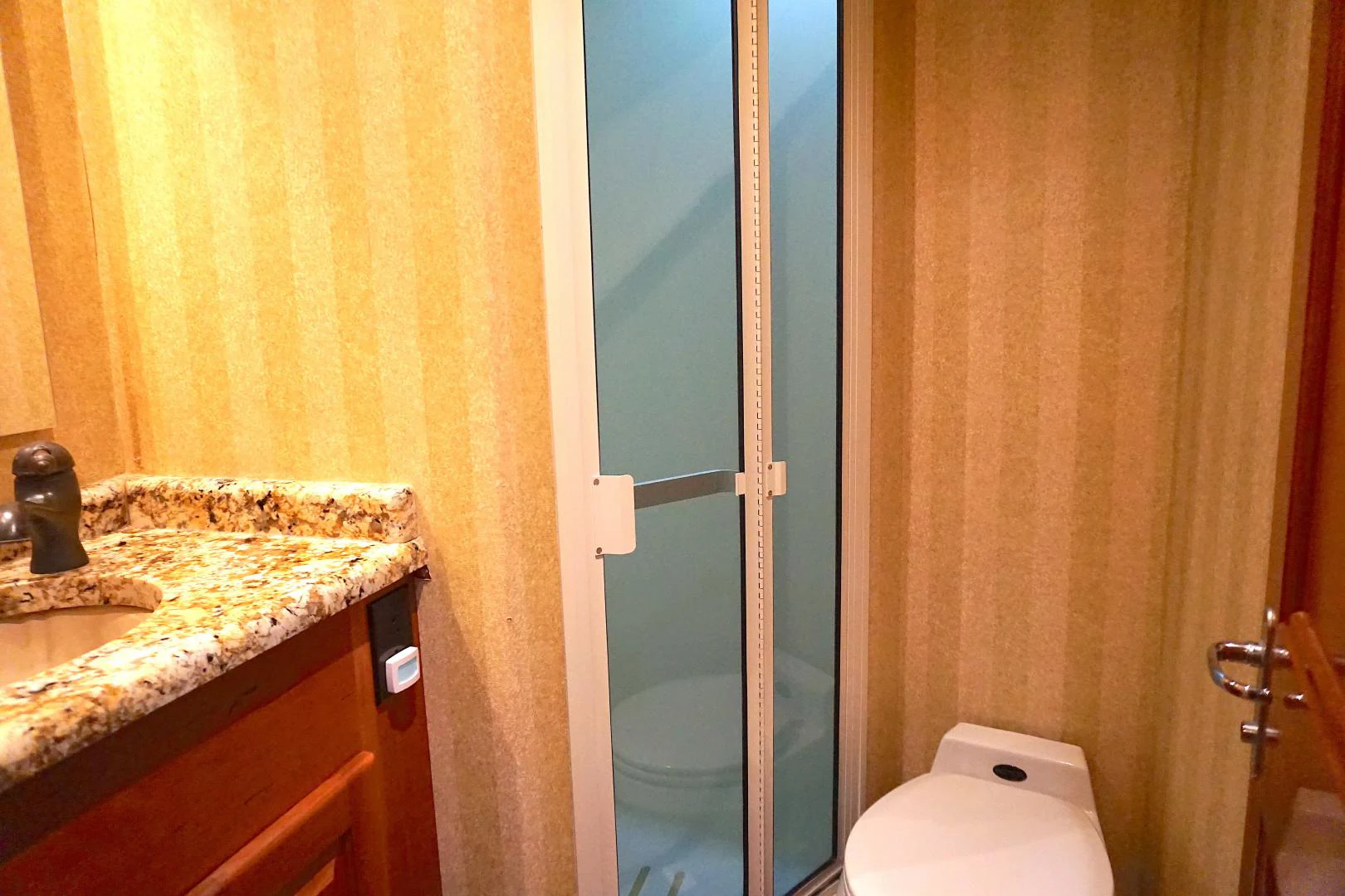 a bathroom with a sink and a toilet aboard CROWN ROYAL Yacht for Sale