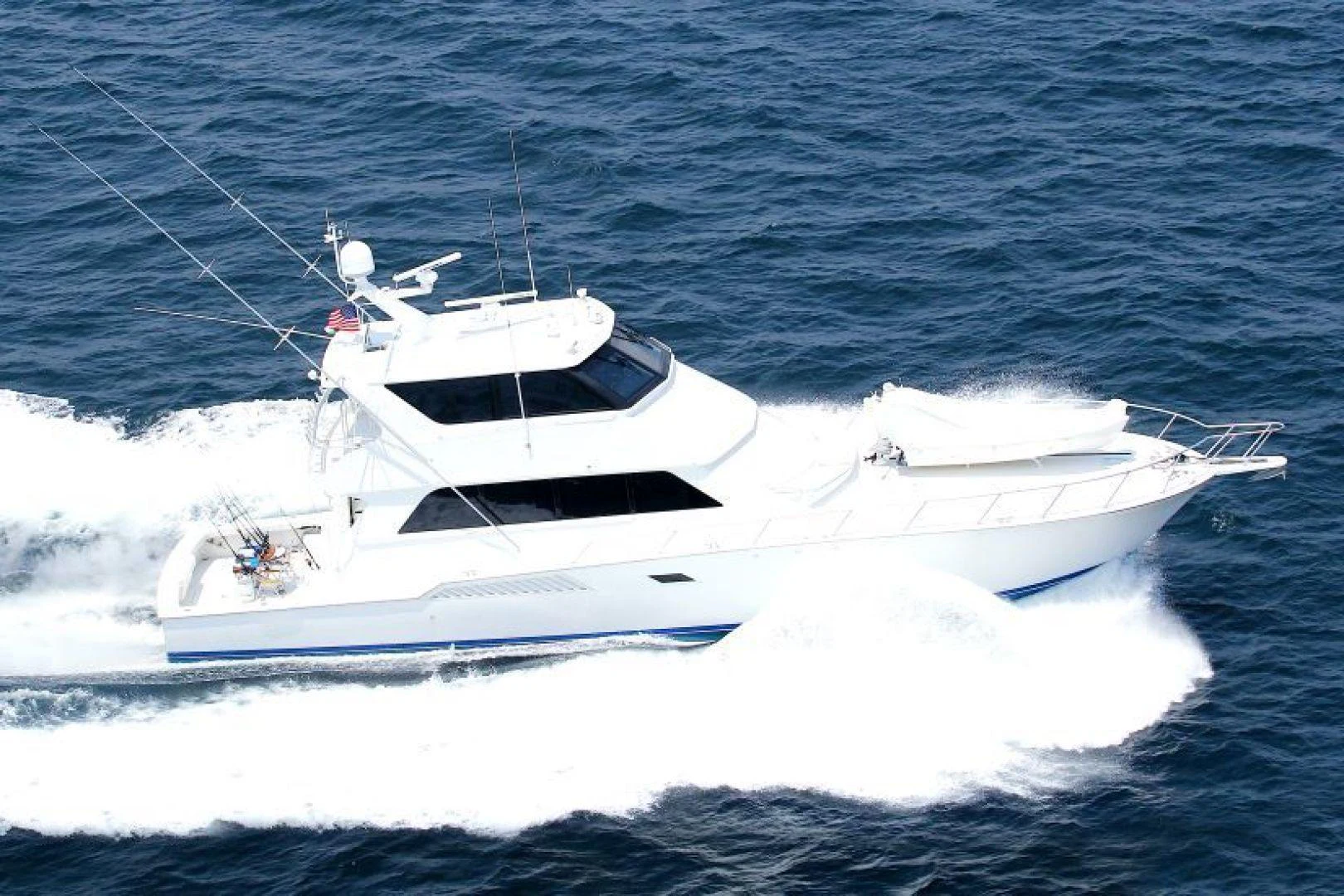 a white yacht in the water aboard CROWN ROYAL Yacht for Sale