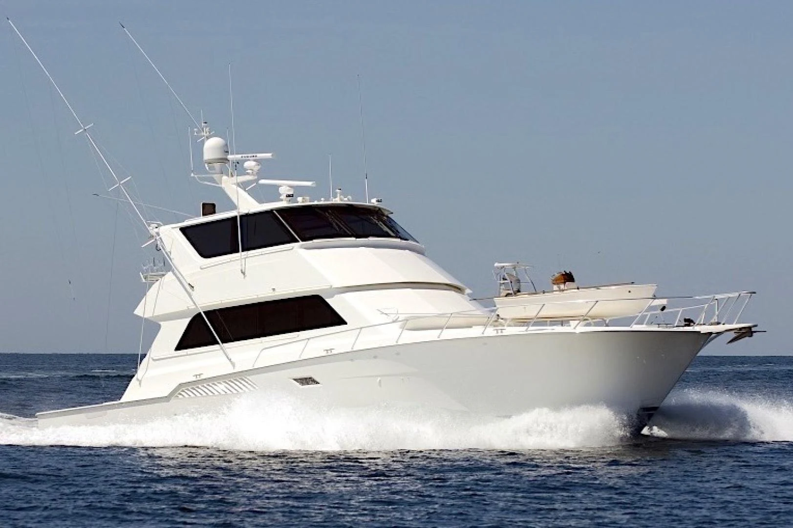 a white yacht in the water aboard CROWN ROYAL Yacht for Sale