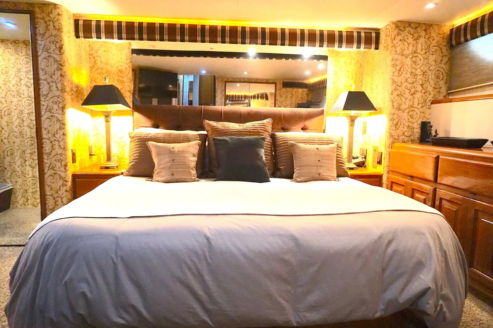 a bed with pillows aboard CROWN ROYAL Yacht for Sale