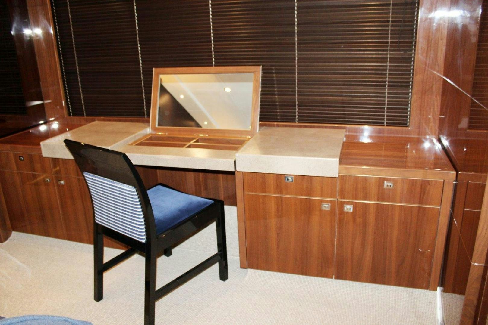 a chair and a microwave in a room aboard PICHOS III Yacht for Sale
