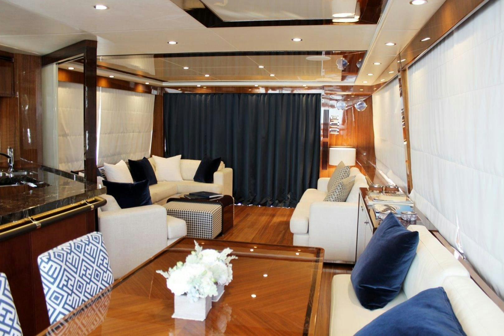 a room with a couch and a table aboard PICHOS III Yacht for Sale