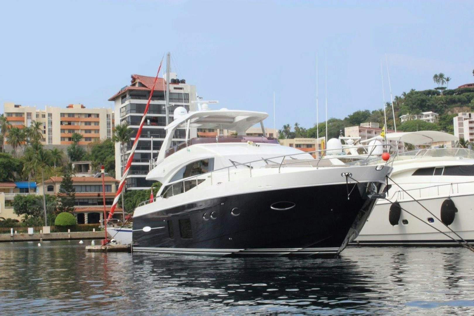 a couple of boats are parked in a harbor aboard PICHOS III Yacht for Sale