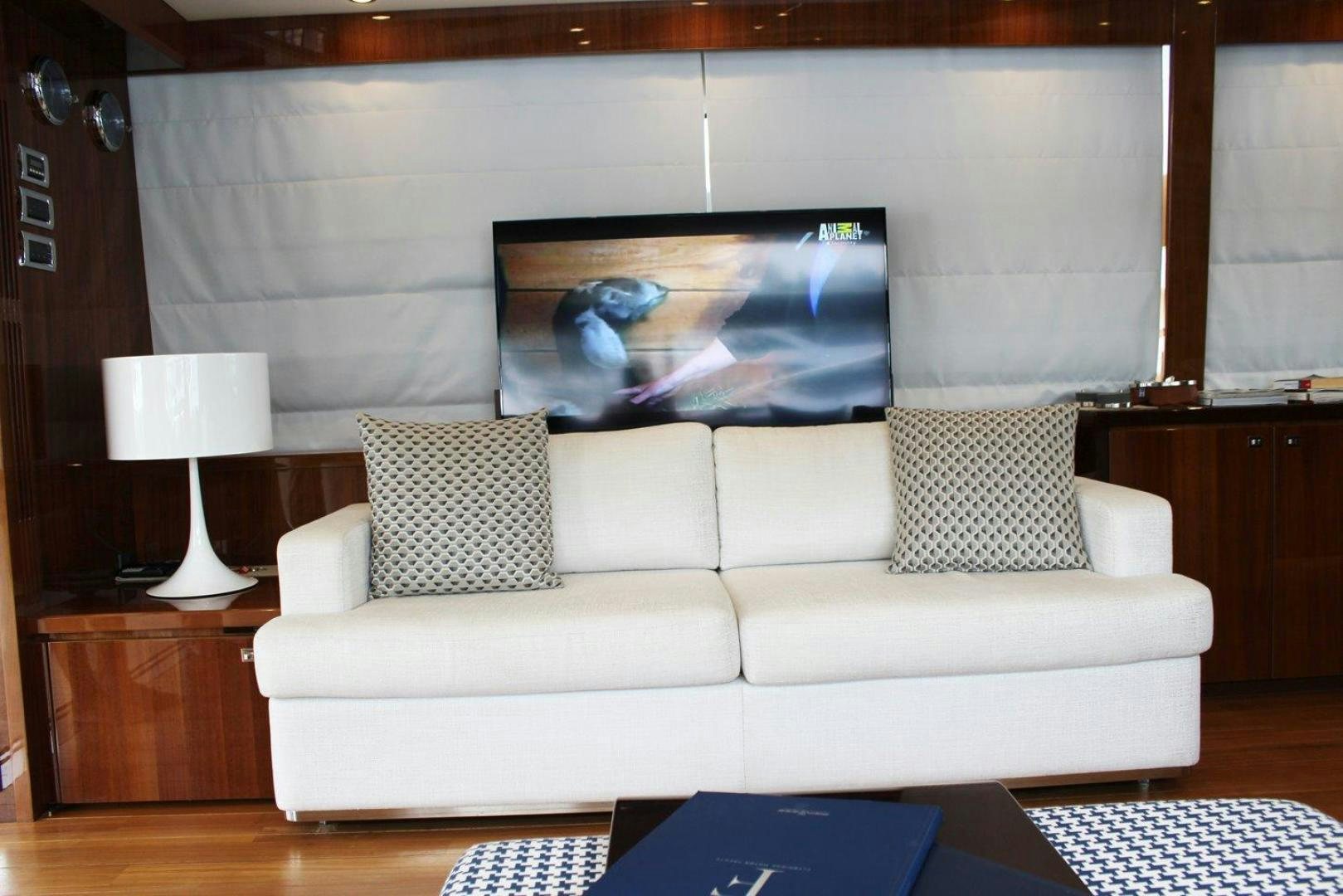 a white couch in a room aboard PICHOS III Yacht for Sale