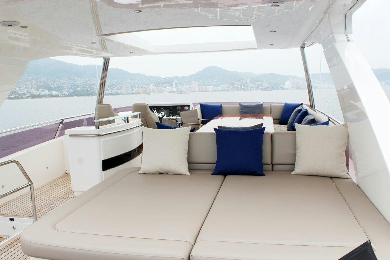a boat with pillows on a deck aboard PICHOS III Yacht for Sale