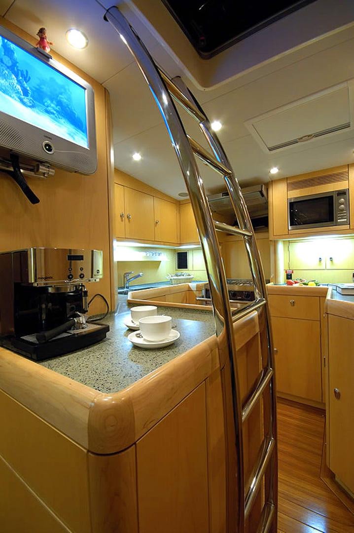 a kitchen with a steel ladder aboard HOLO KAI Yacht for Sale