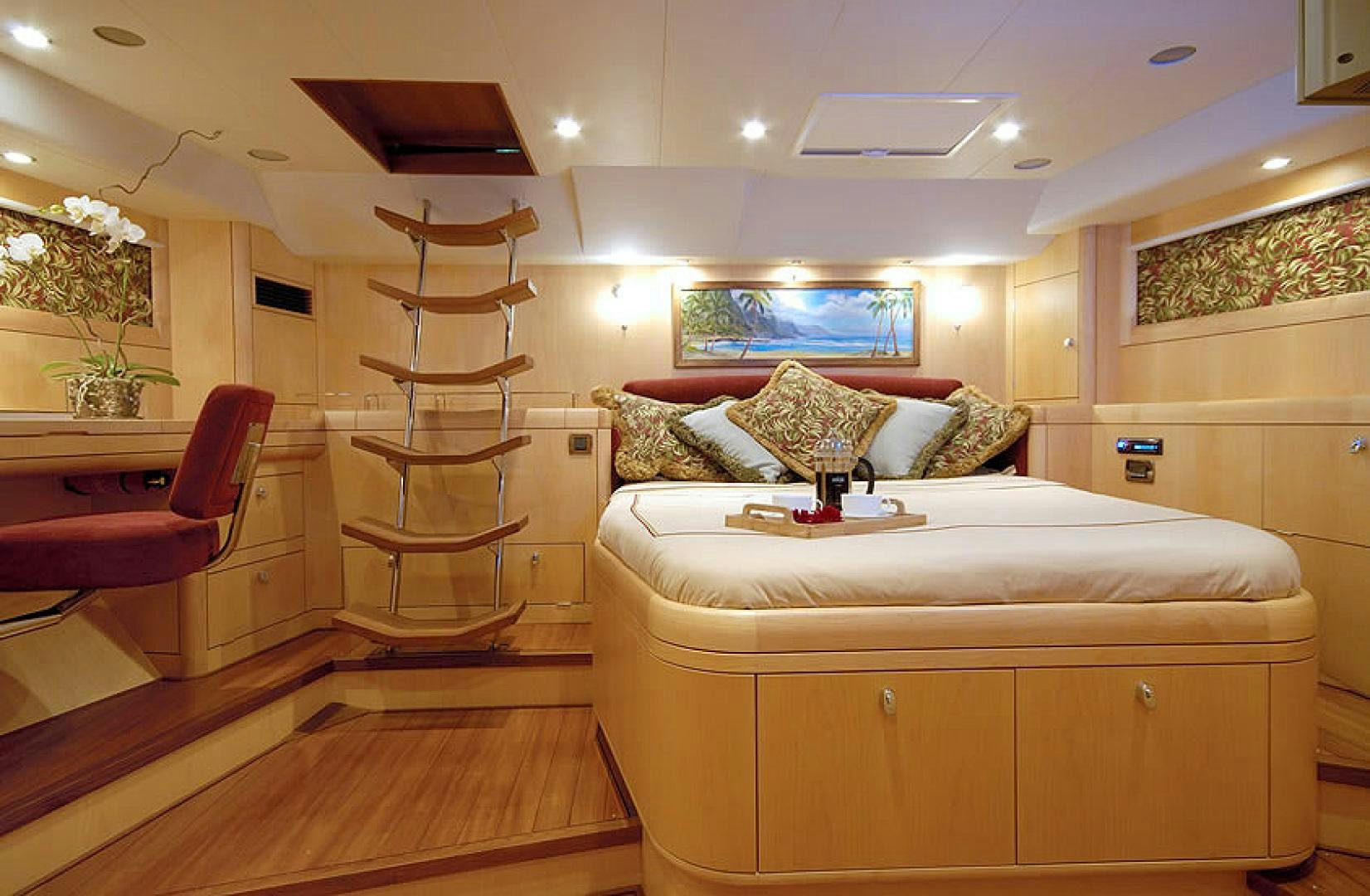 a bedroom with a bed and a ladder aboard HOLO KAI Yacht for Sale
