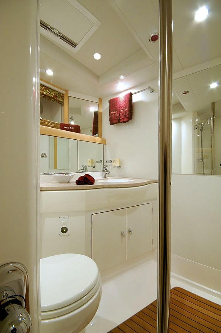 a bathroom with a sink and a toilet aboard HOLO KAI Yacht for Sale