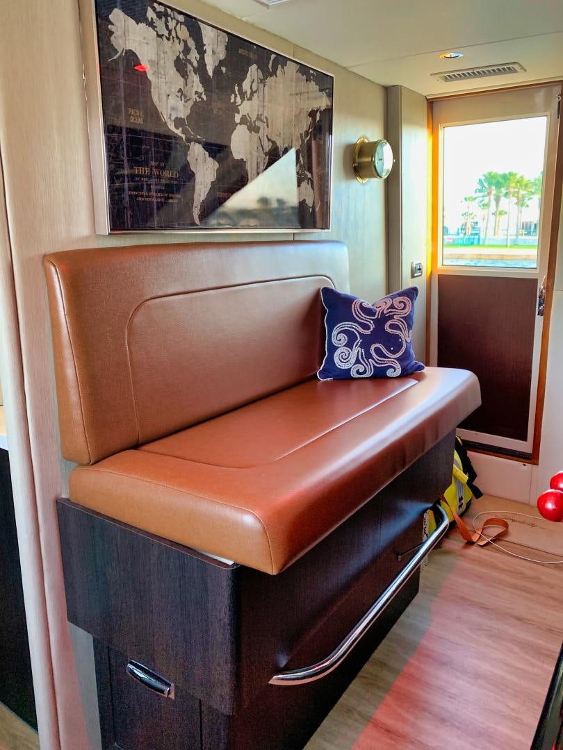a chair with a pillow on it aboard SIMPLICITY Yacht for Sale