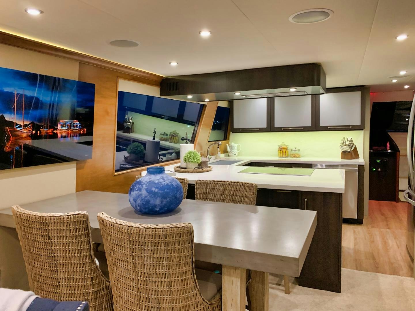a kitchen with a table and chairs aboard SIMPLICITY Yacht for Sale