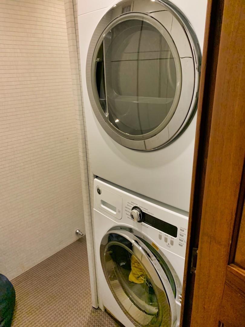 a washing machine in a room aboard SIMPLICITY Yacht for Sale