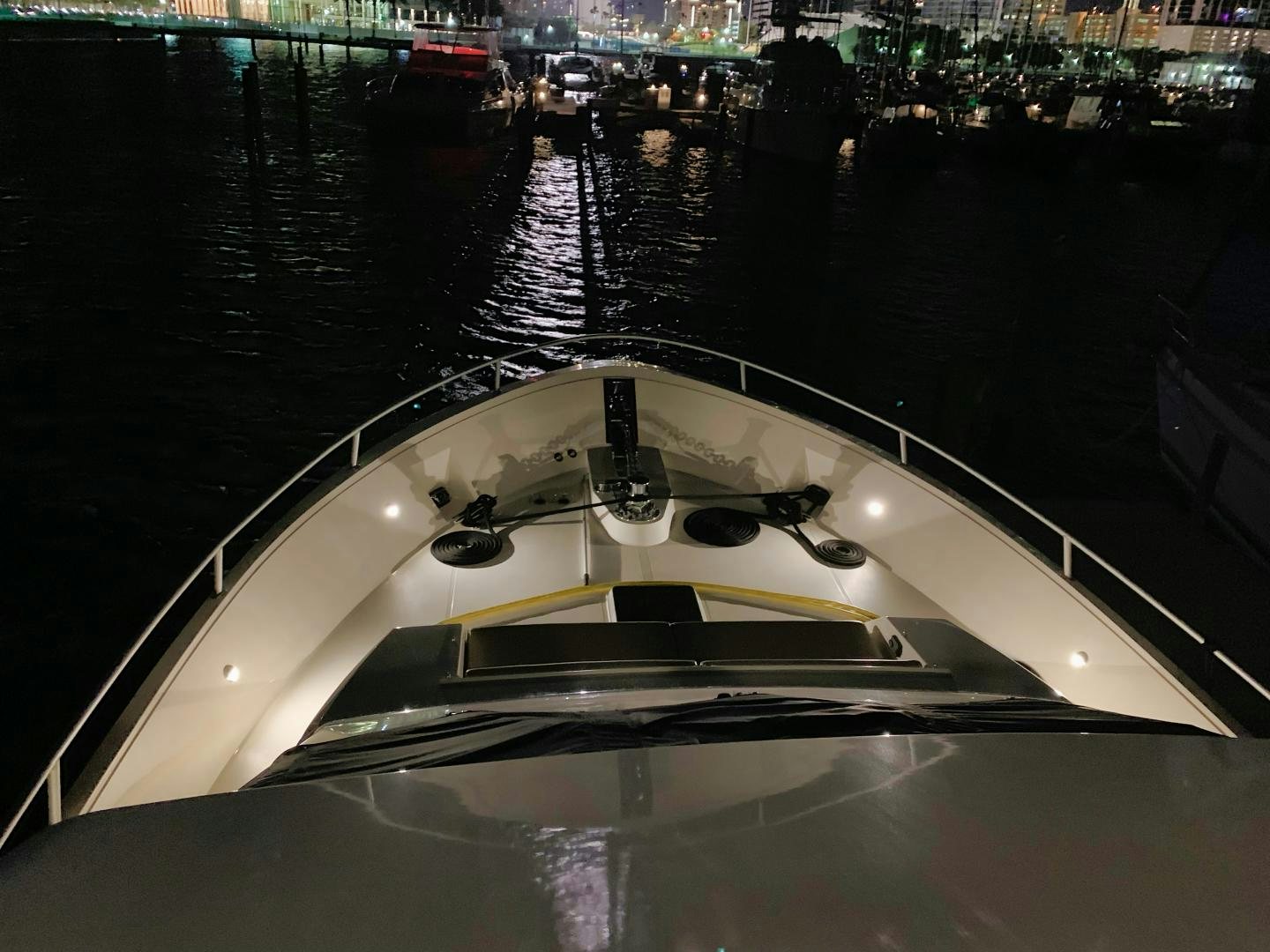 a white sports car on a dock aboard SIMPLICITY Yacht for Sale