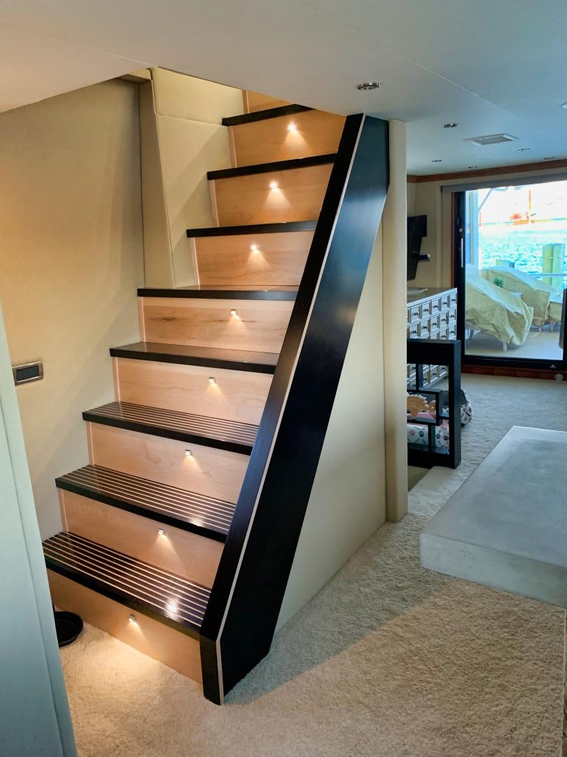 a wood cabinet in a room aboard SIMPLICITY Yacht for Sale