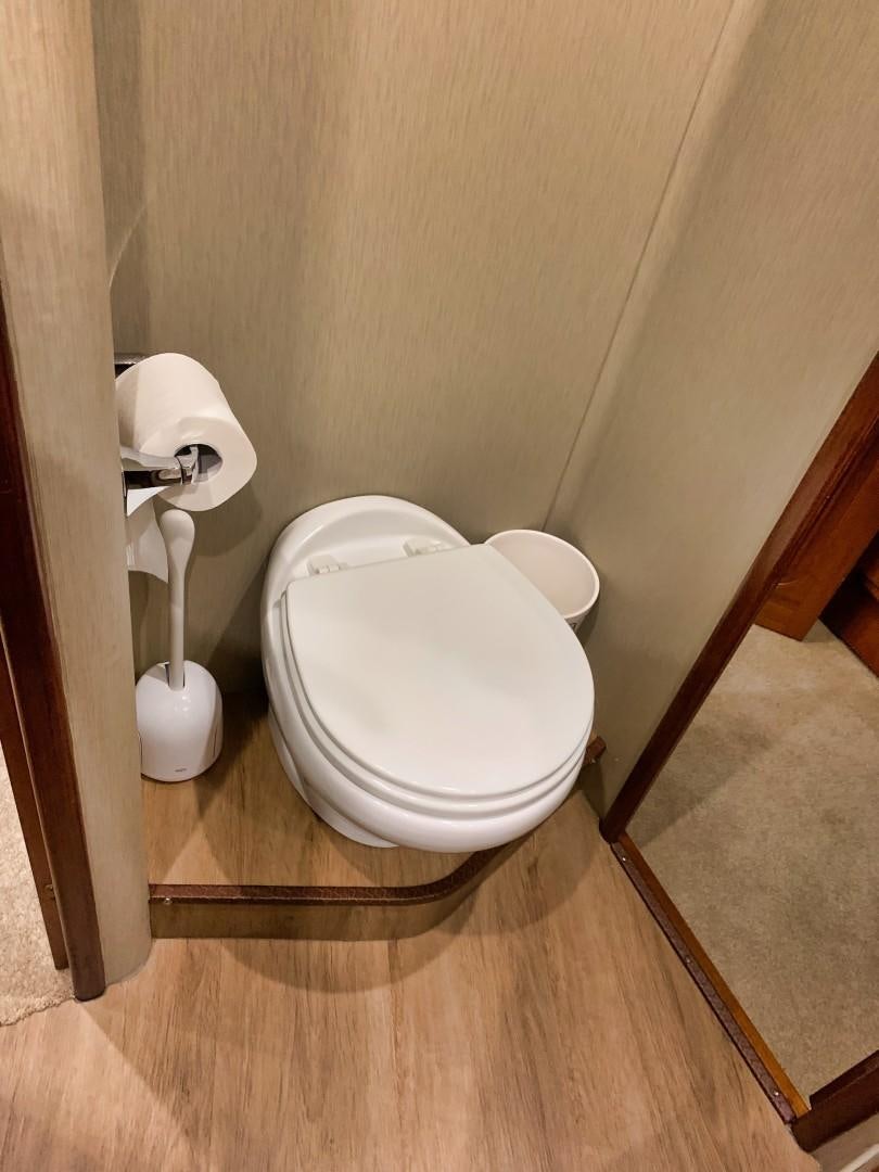 a toilet in a bathroom aboard SIMPLICITY Yacht for Sale