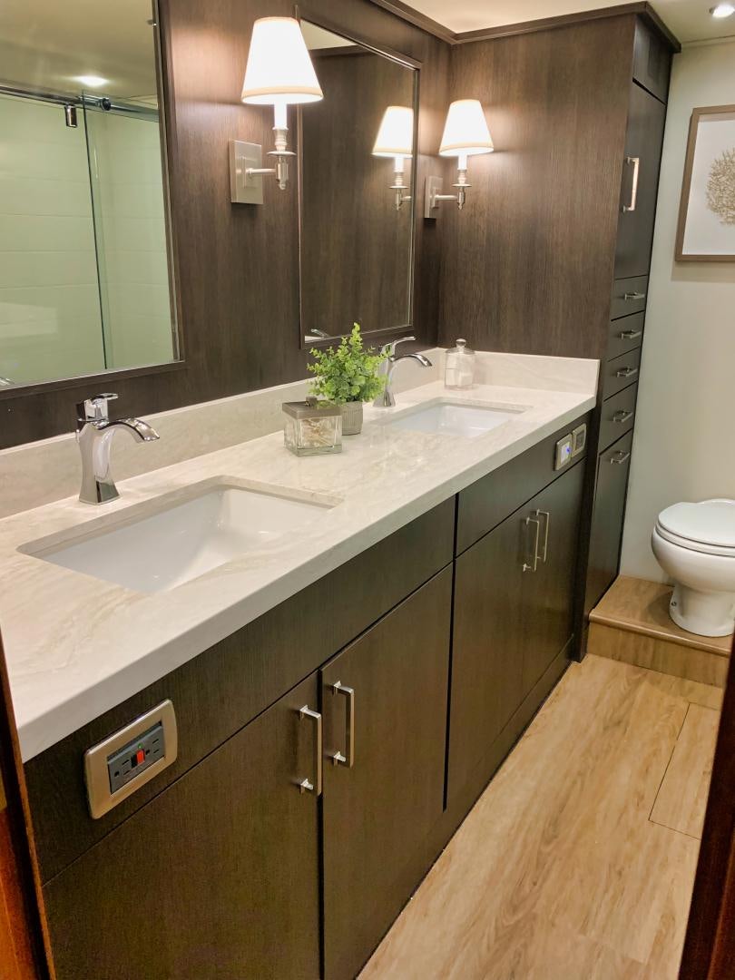 a bathroom with a large mirror aboard SIMPLICITY Yacht for Sale