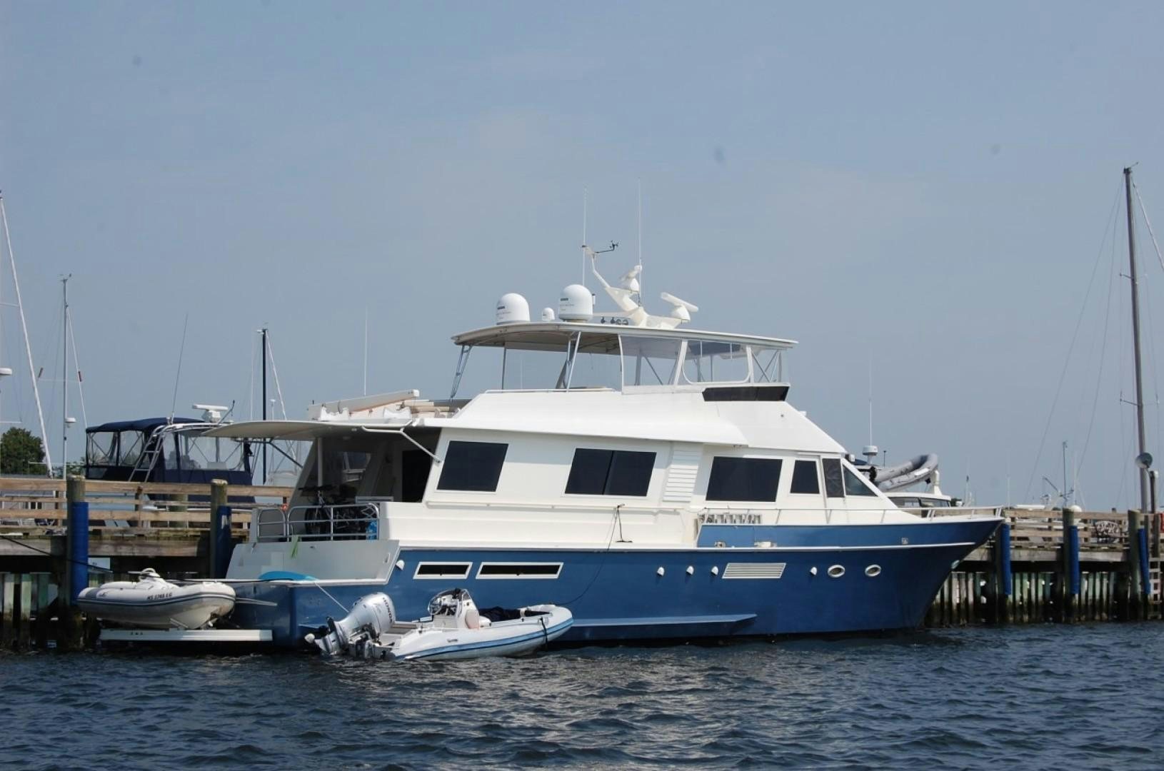 a large white boat in the water aboard SIMPLICITY Yacht for Sale
