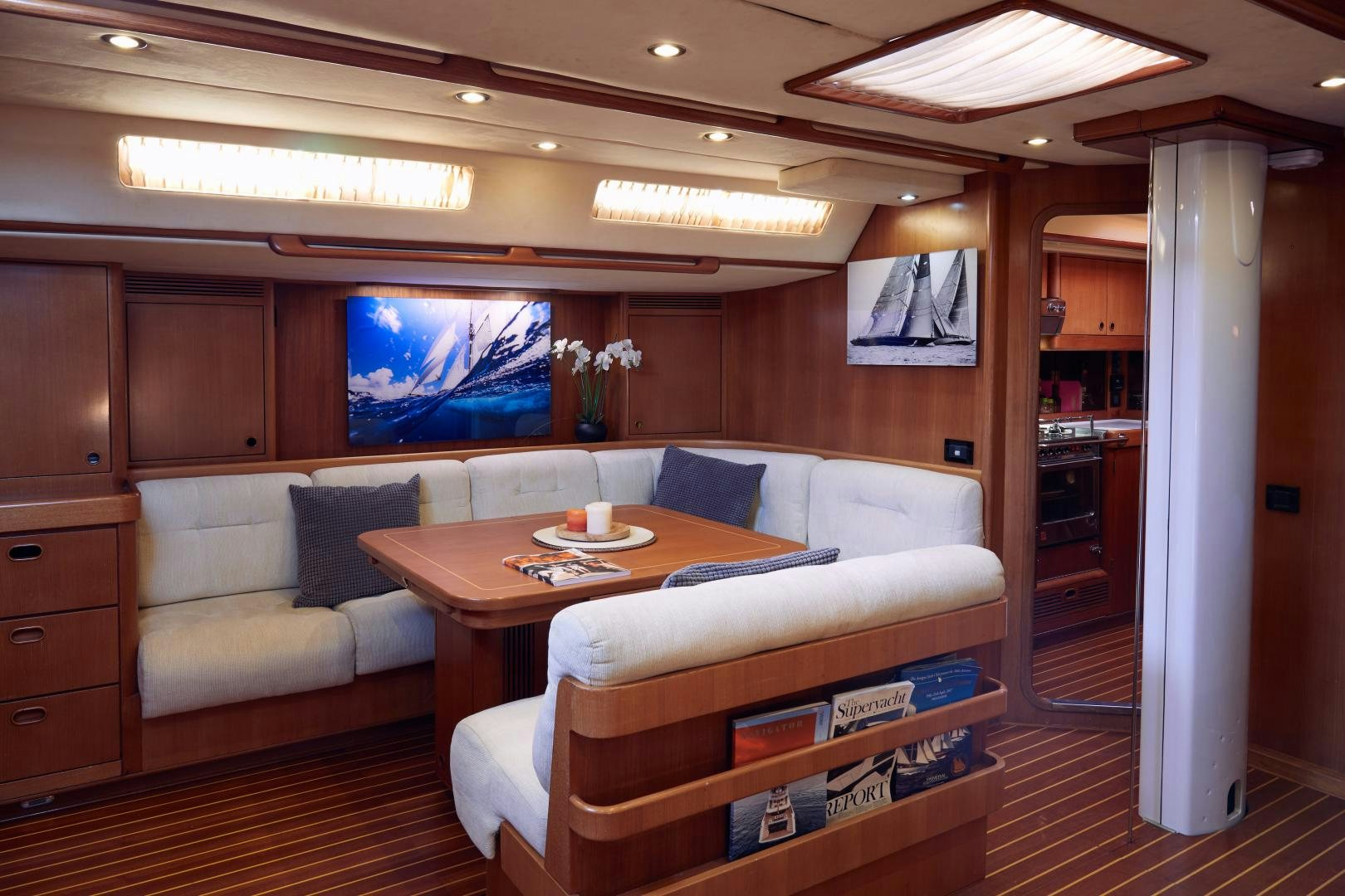 a living room with a couch and a table aboard BALEINE Yacht for Sale
