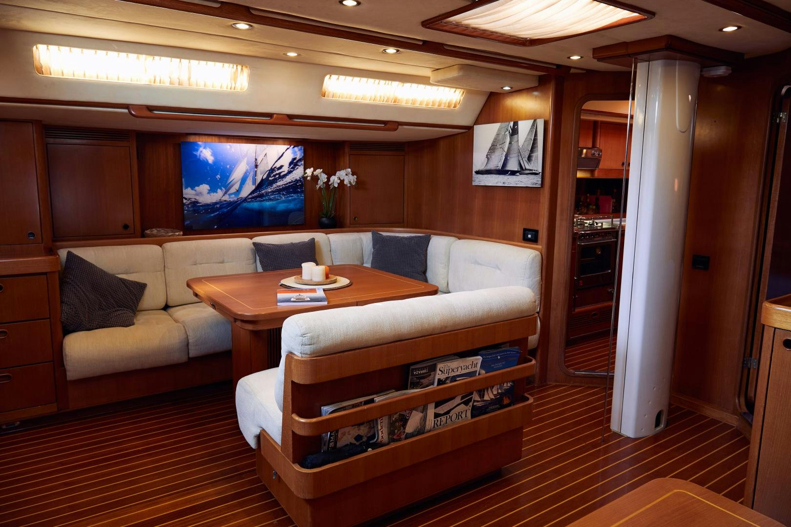 a living room with a couch and a coffee table aboard BALEINE Yacht for Sale