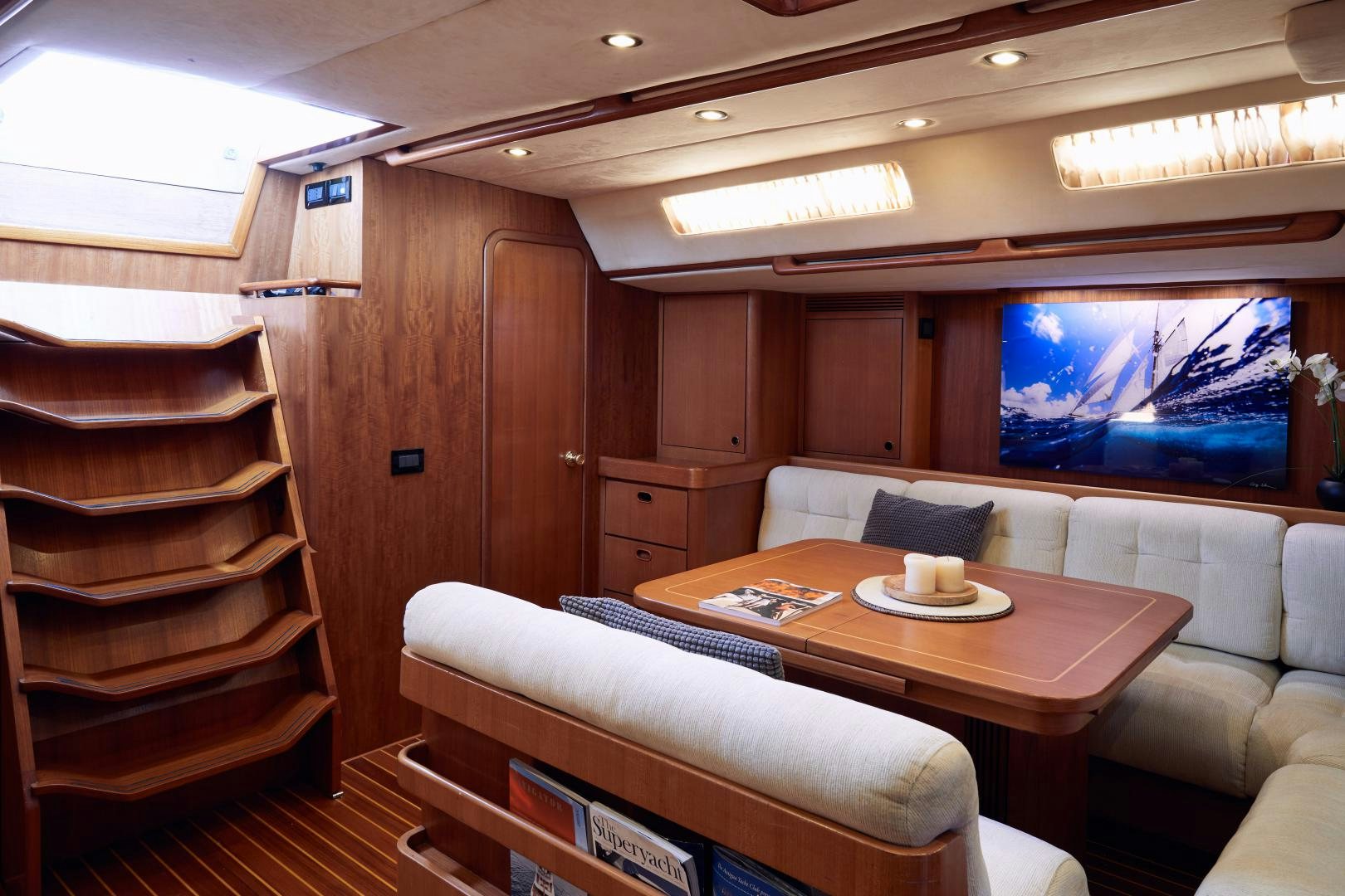 a room with a couch and a table aboard BALEINE Yacht for Sale