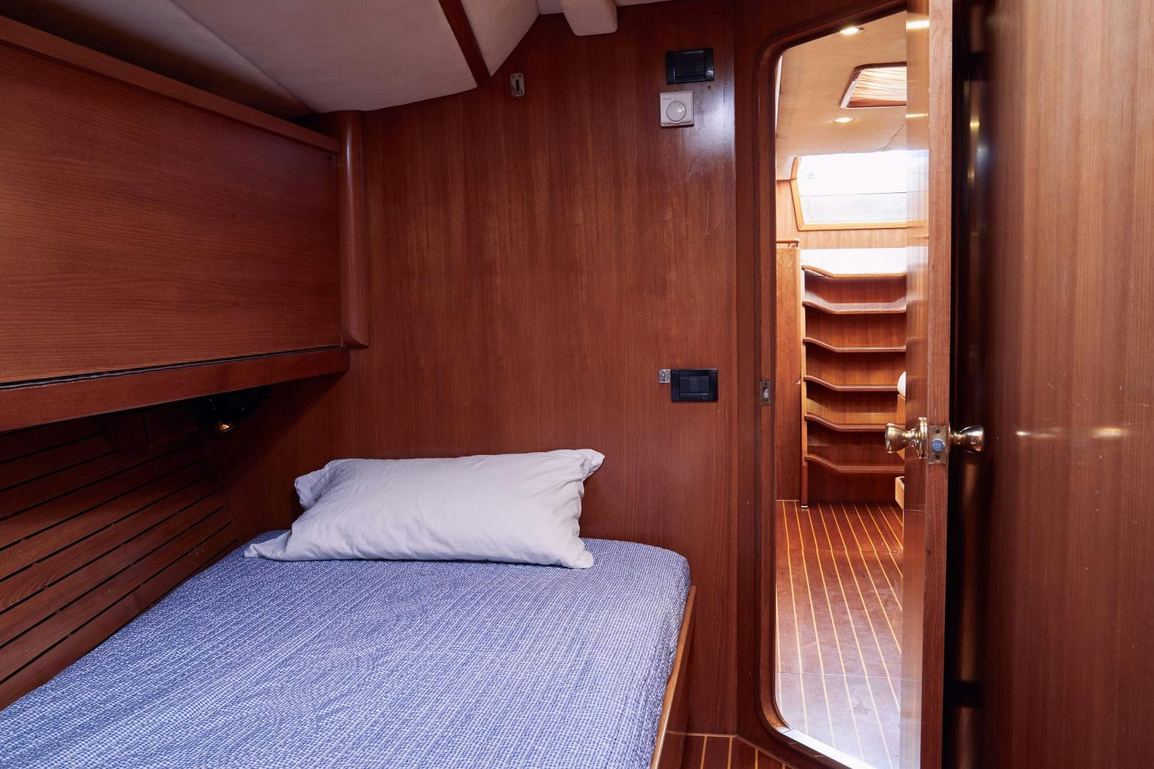 a bed in a room aboard BALEINE Yacht for Sale