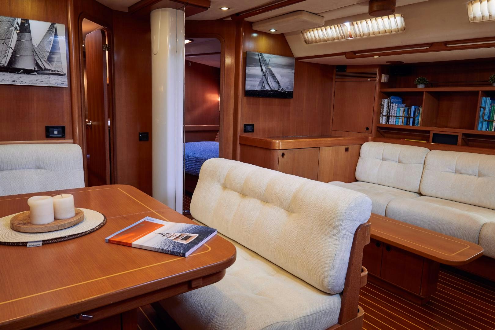 a living room with a couch and a coffee table aboard BALEINE Yacht for Sale