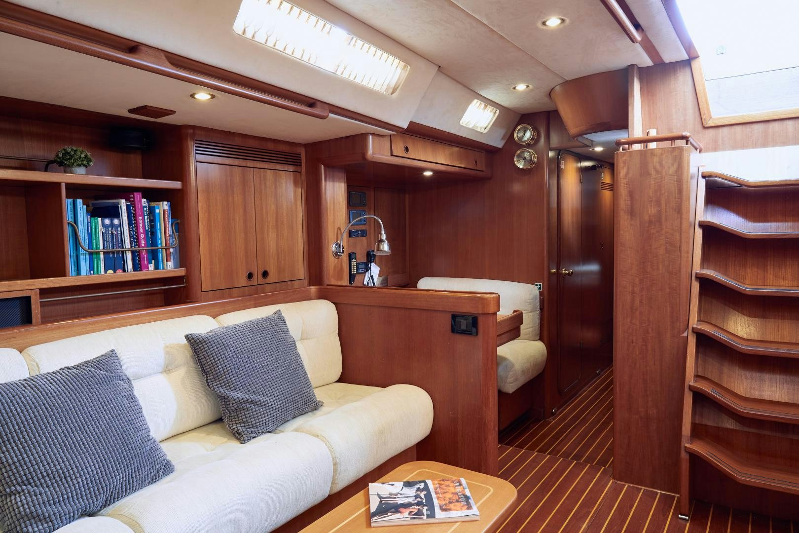a living room with a wood door aboard BALEINE Yacht for Sale