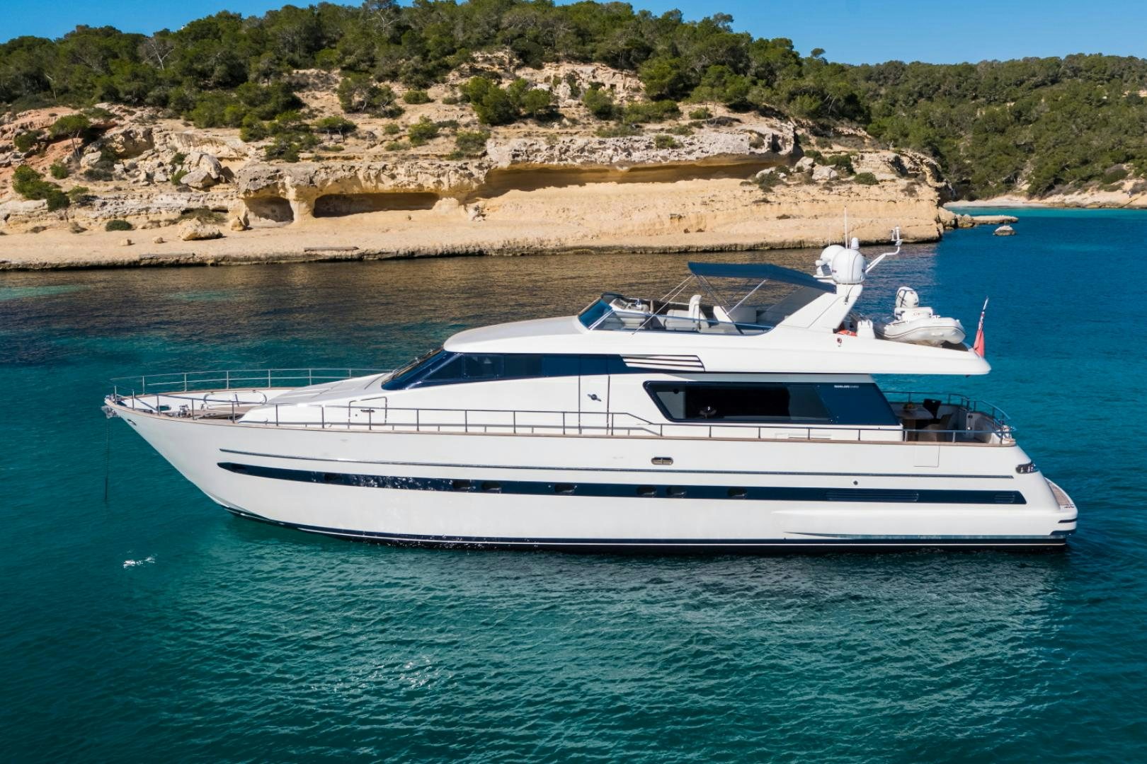 a white yacht on the water aboard MYTHOS Yacht for Sale