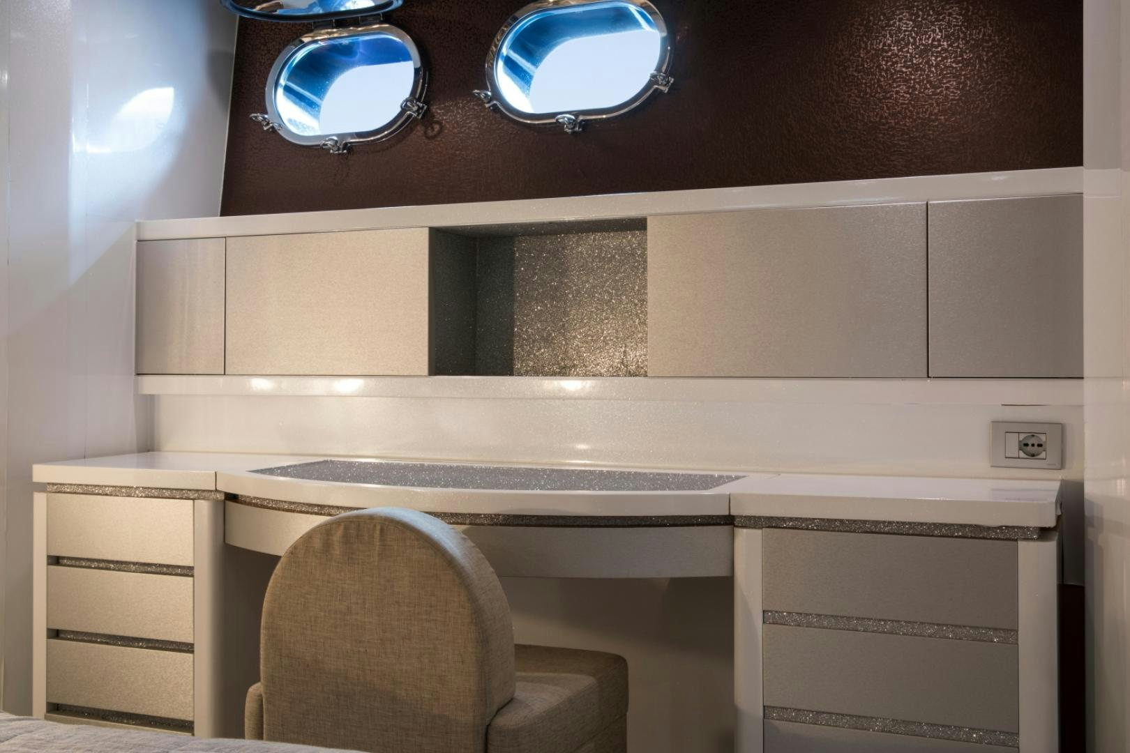 a chair and a desk in a room aboard MYTHOS Yacht for Sale
