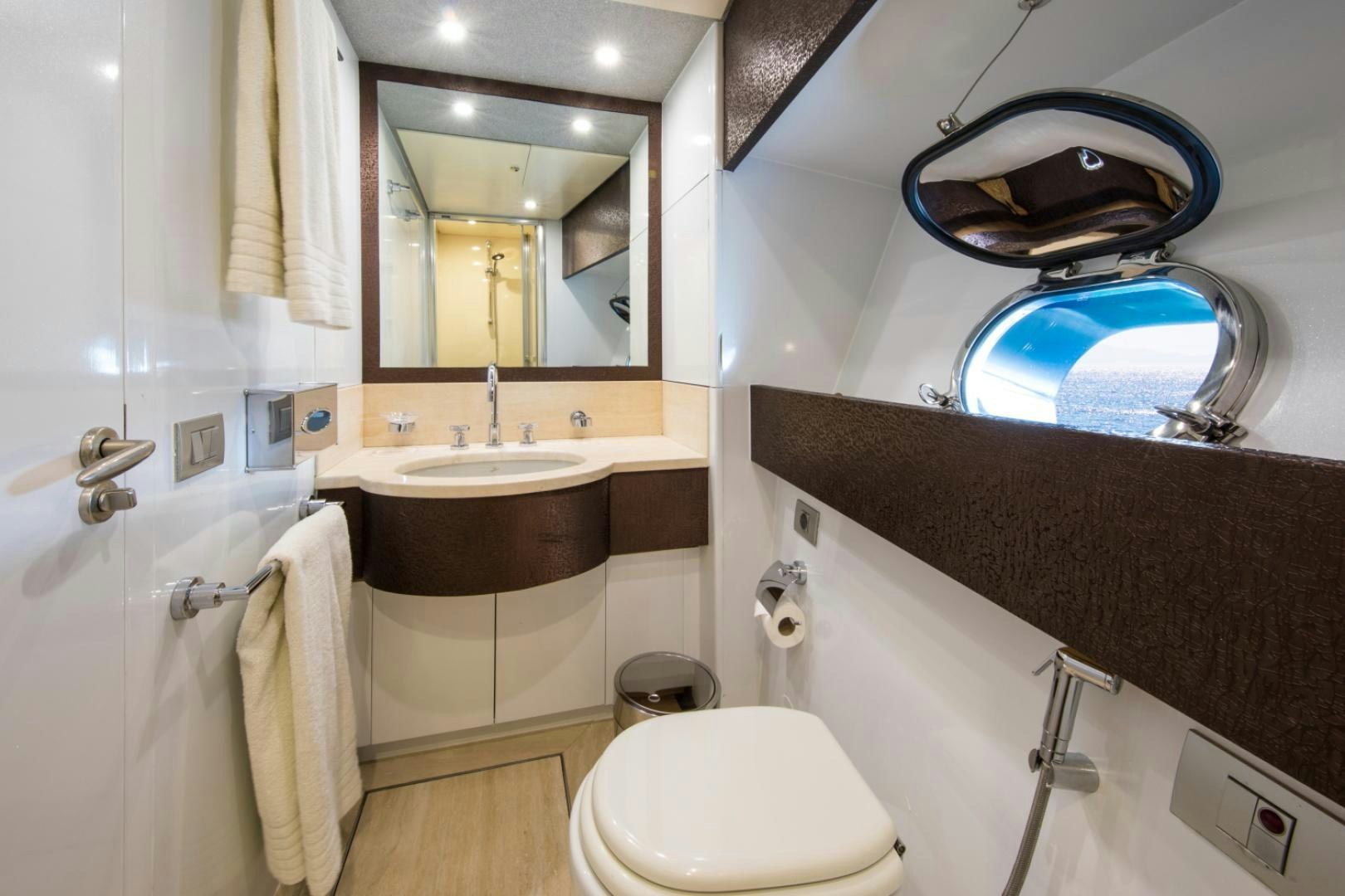 a bathroom with a large mirror aboard MYTHOS Yacht for Sale
