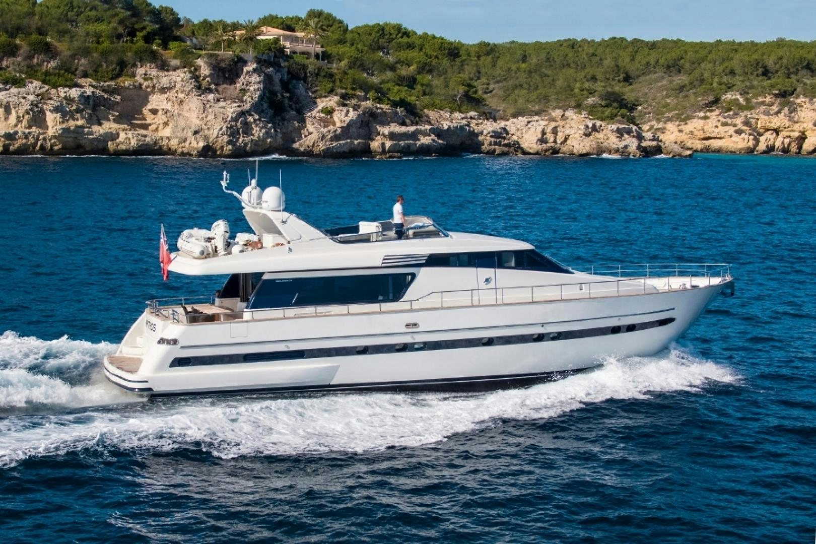a white yacht on the water aboard MYTHOS Yacht for Sale